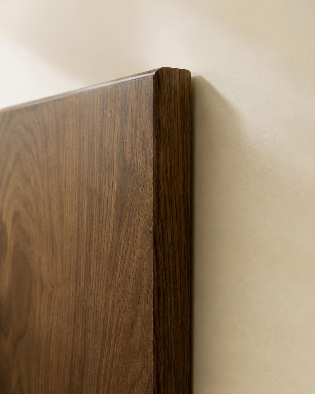 Cabinet door edge wrapped in a walnut wood film